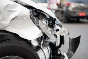 A smashed front end of a car after a truck accident. What steps should I take immediately after a truck accident?